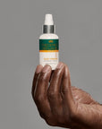 black man holding frederick benjamin easy primer, best pre shave product for black men, best product for pain free shaving, best product for men of color to prevent razor bumps