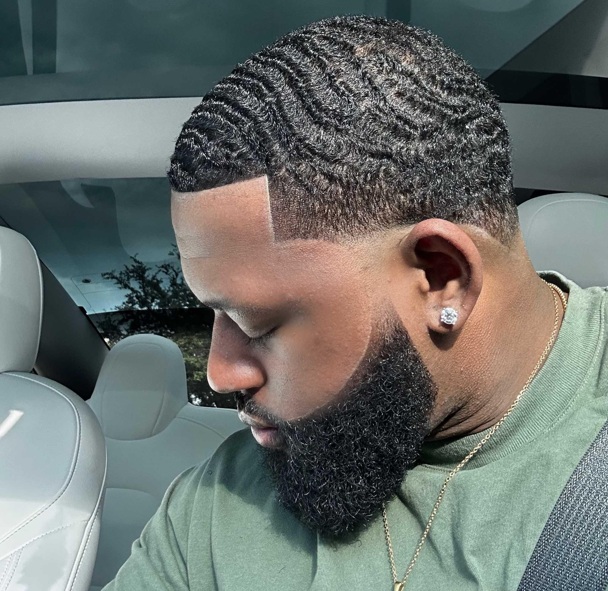 Black man with healthy beard and 360 waves
