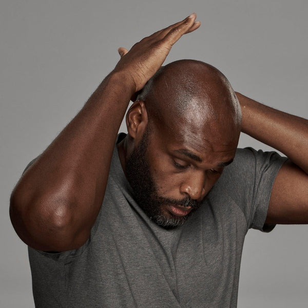 black man using frederick benjamin easy primer on head, best product for men who shave facial hair and head, best shaving product for bald men of color, best product for pain free shaving