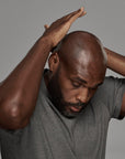 black man using frederick benjamin easy primer on head, best product for men who shave facial hair and head, best shaving product for bald men of color, best product for pain free shaving